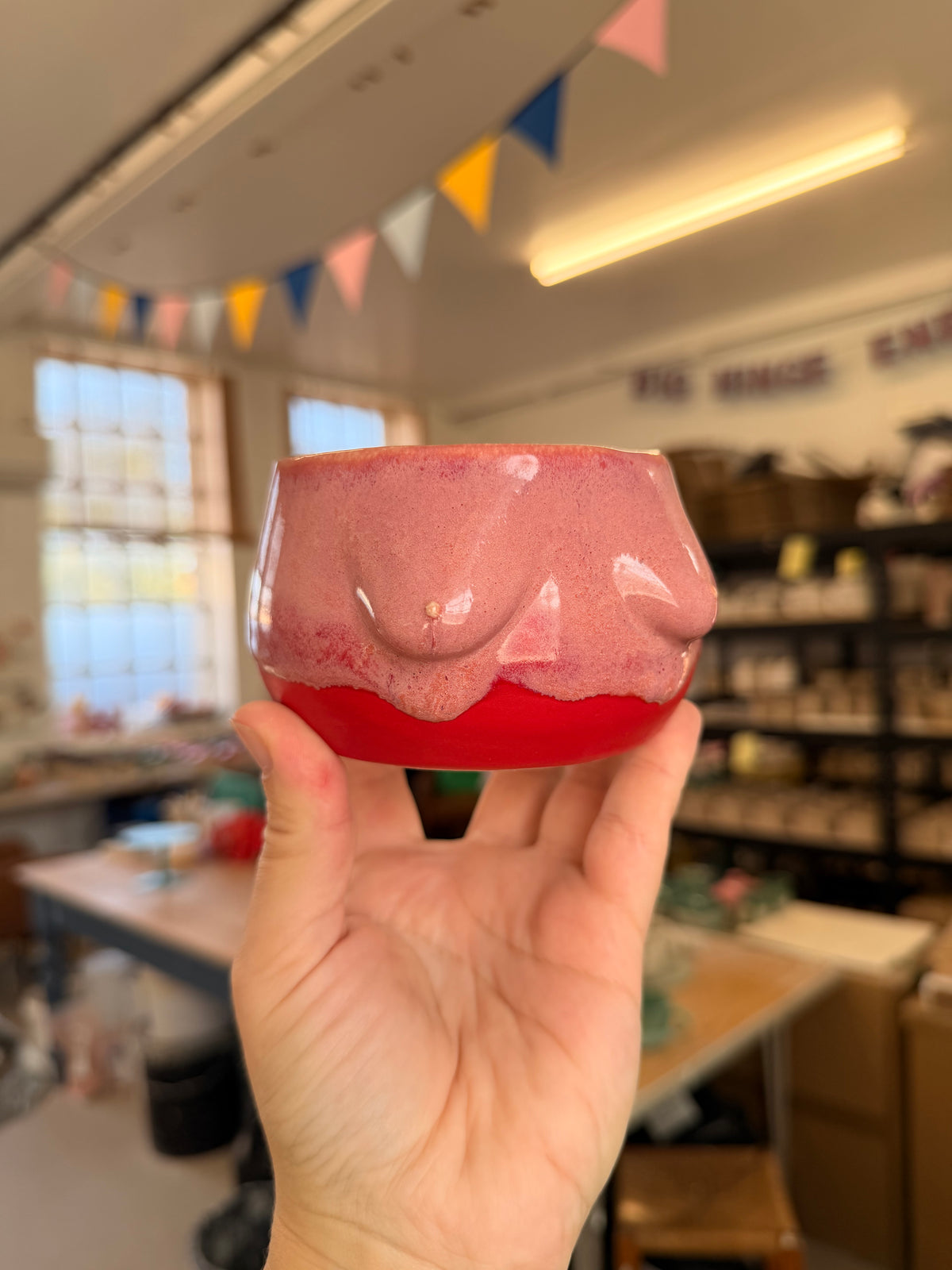 Wheel thrown pink and red boob pot