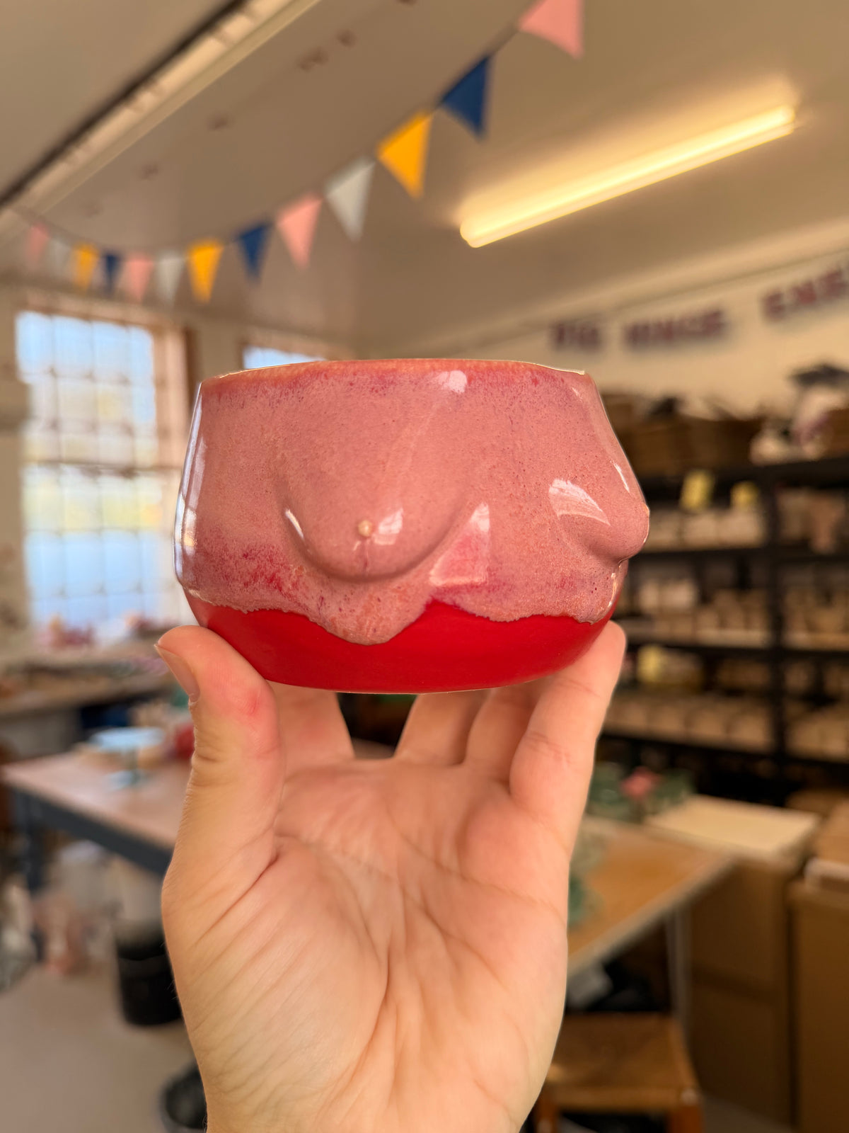 Wheel thrown pink and red boob pot